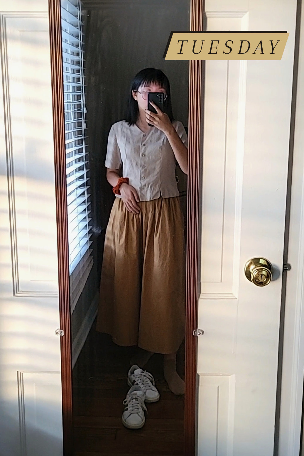 mirror selfie of me wearing a khaki-colored short-sleeve button-up with a long brown skirt